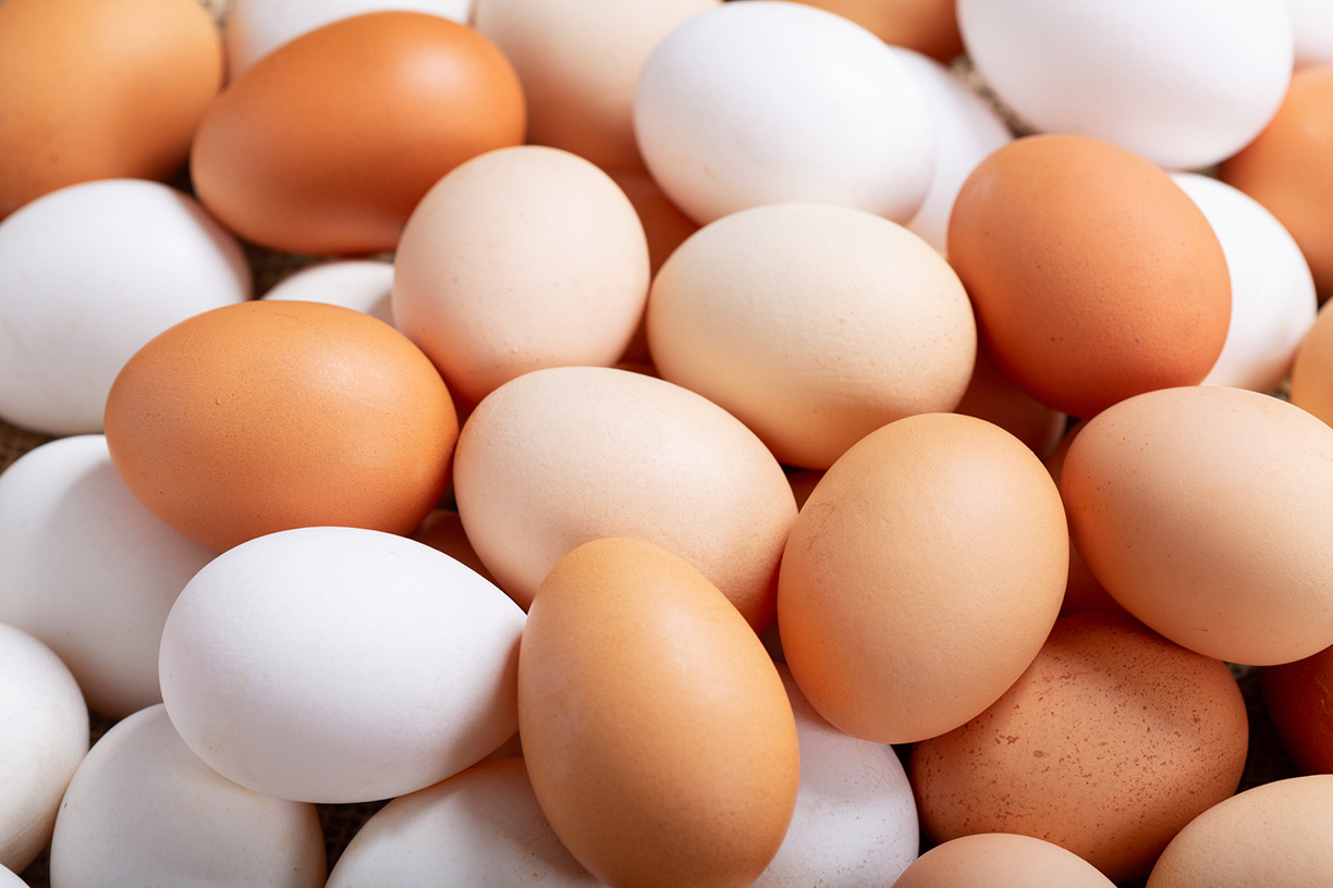 Pile of white and brown eggs