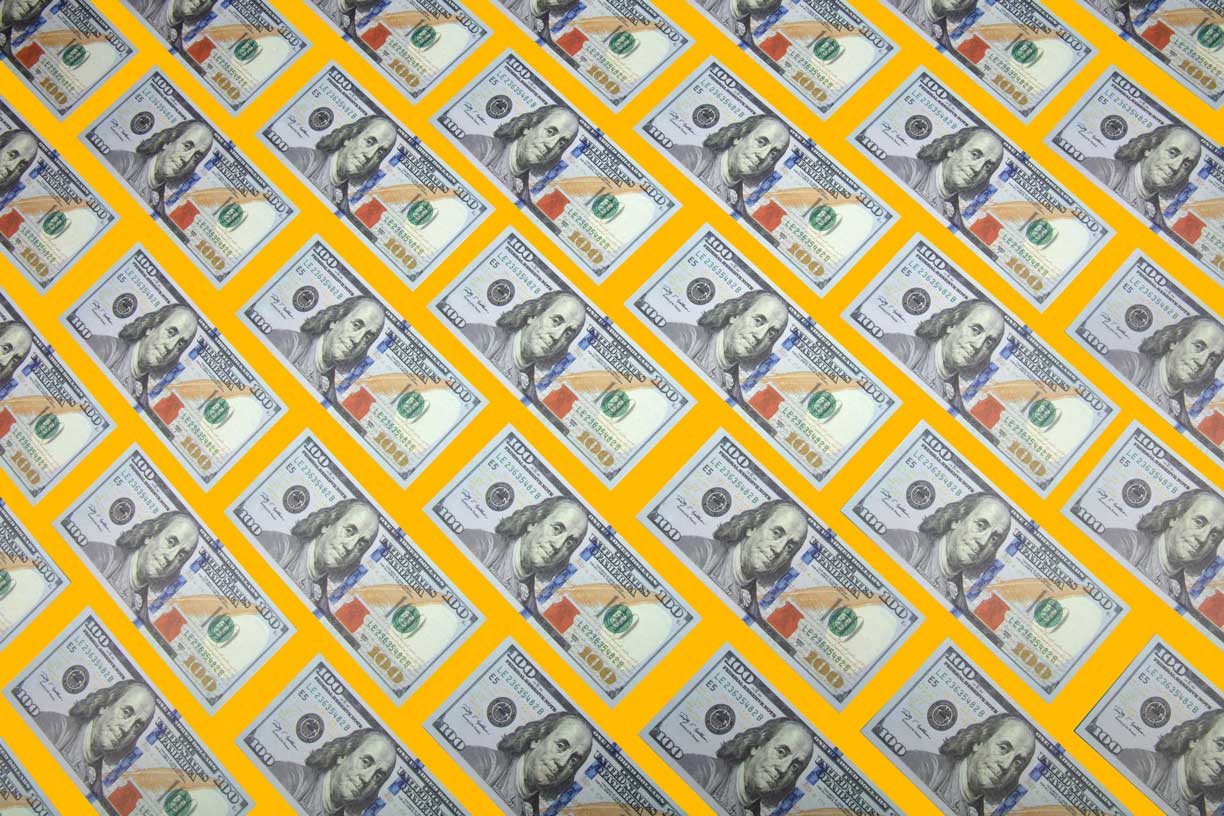 US currency on yellow background