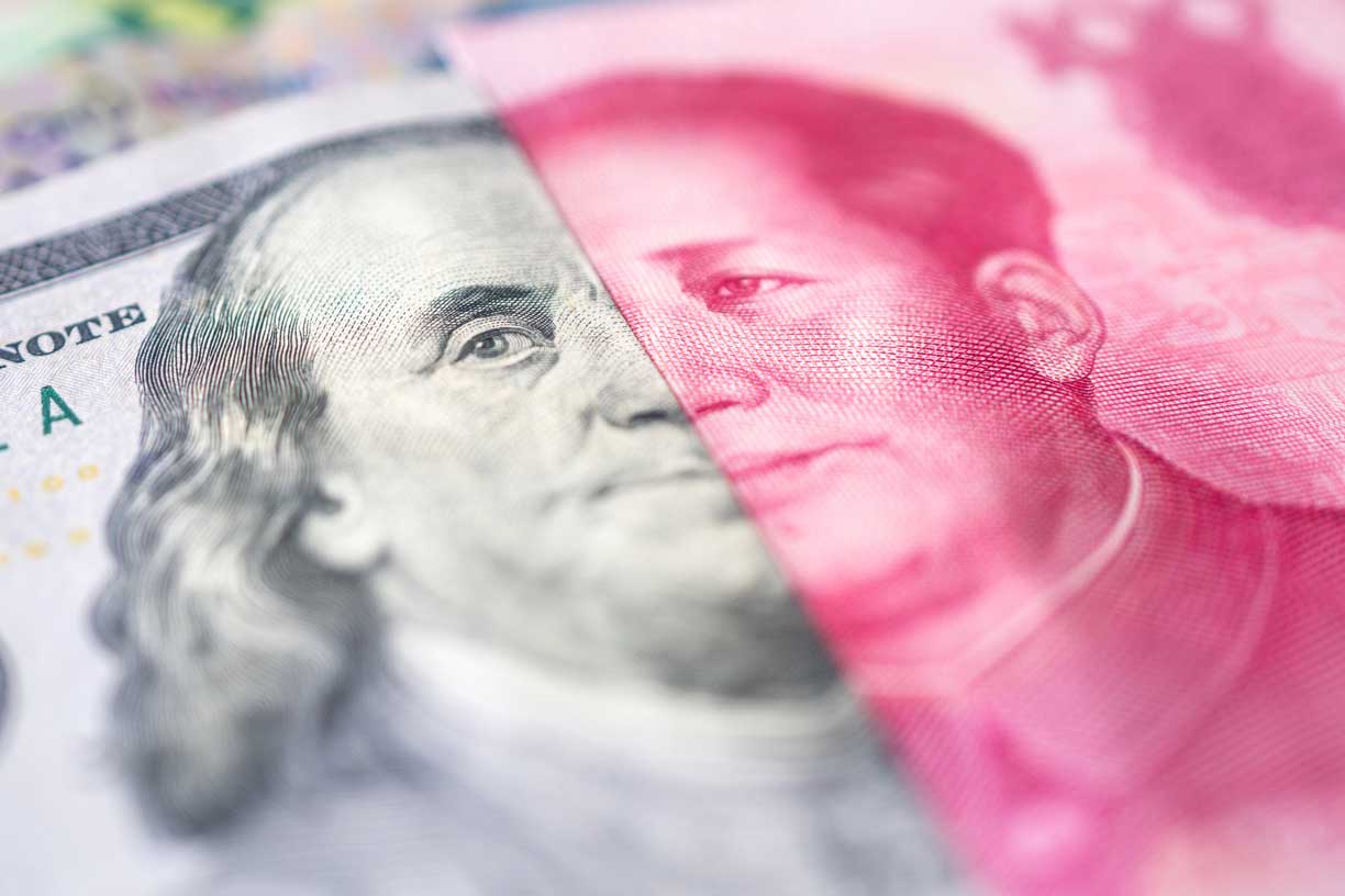 half faces of US and China currency