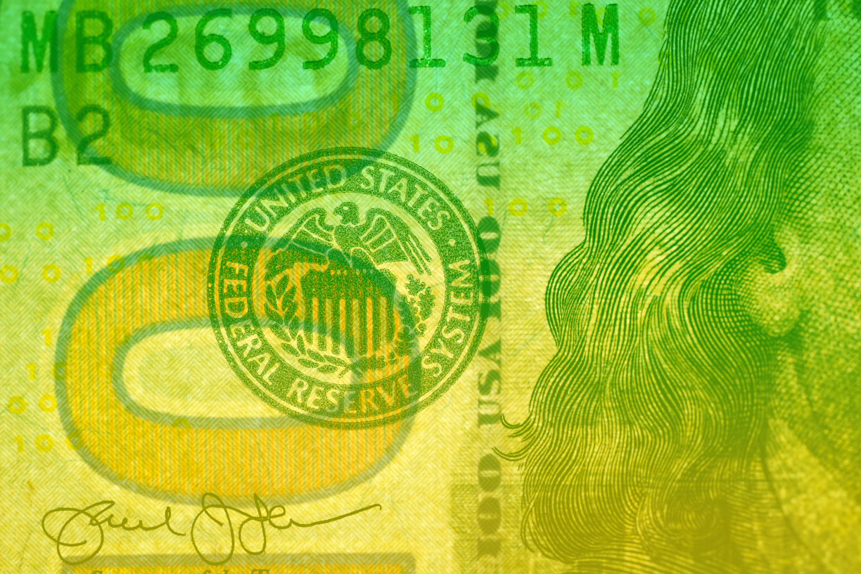 Close-up macro view of a US banknote featuring the Federal Reserve System seal