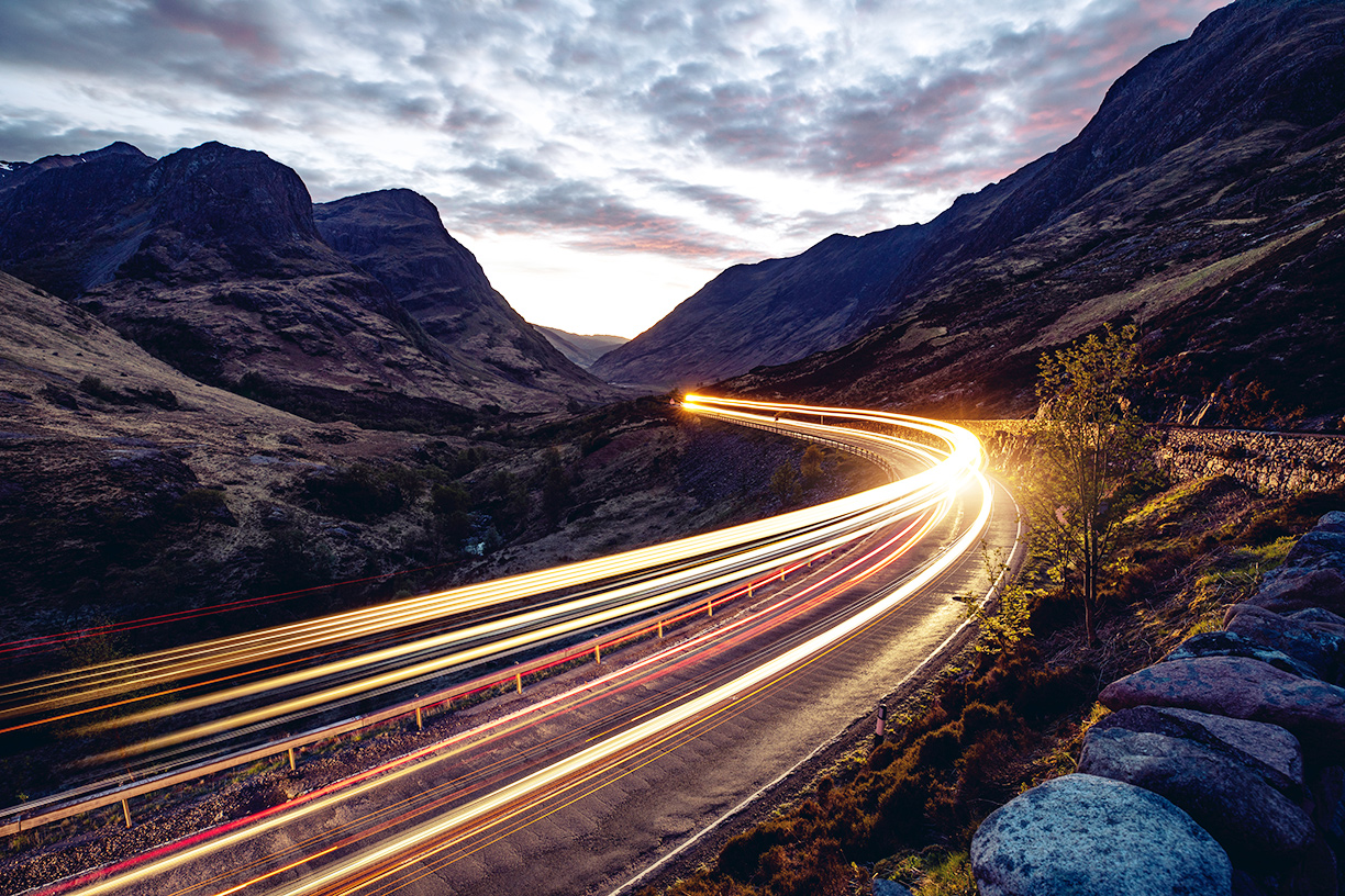 Light trails on road at dusk