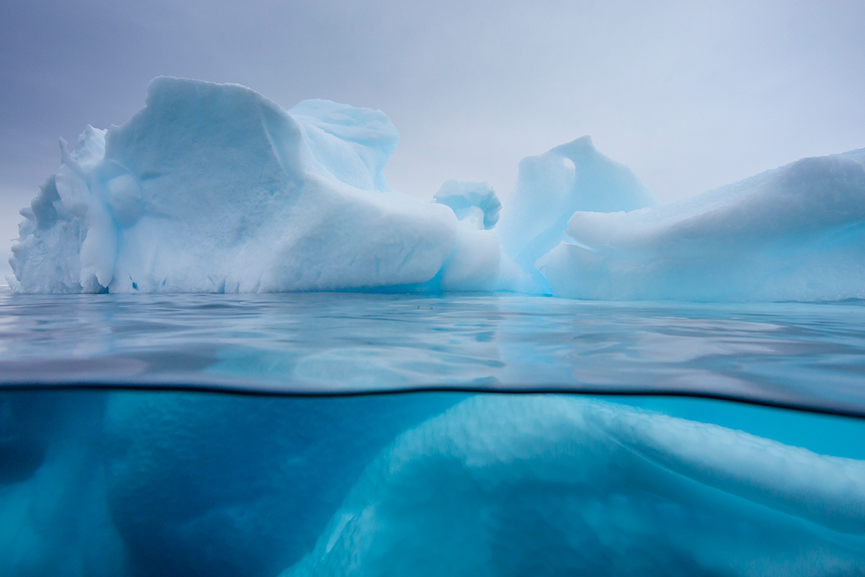 Iceberg in blue water