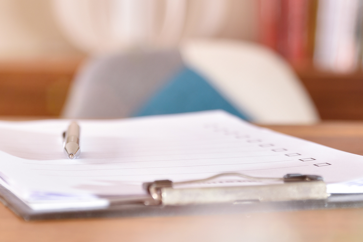 Checklist on wooden table in office